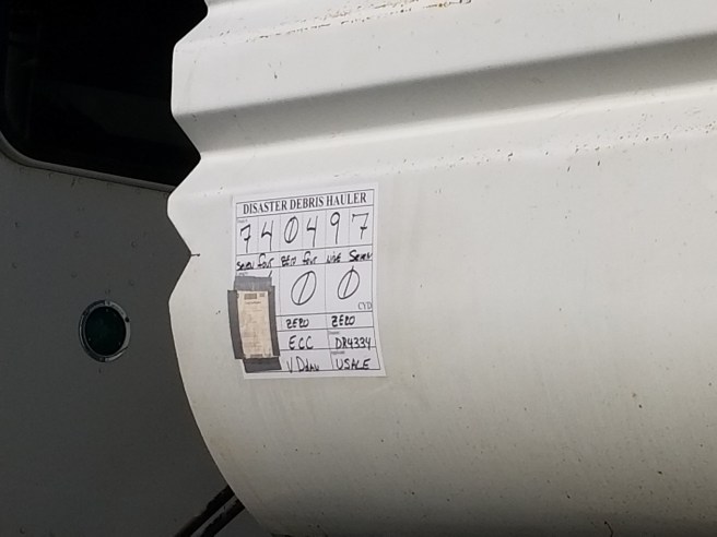 Sign on a Disaster Debris hauling truck